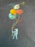 Astronaut Holding Planets